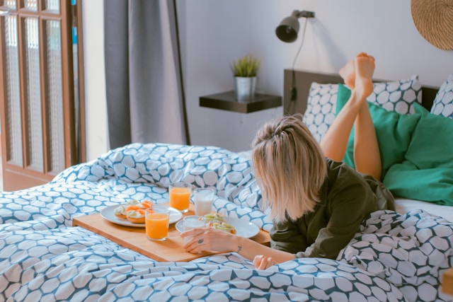 woman bed breakfast